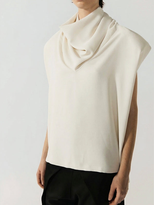 #off-white White sleeveless top worn by a person on a plain background
