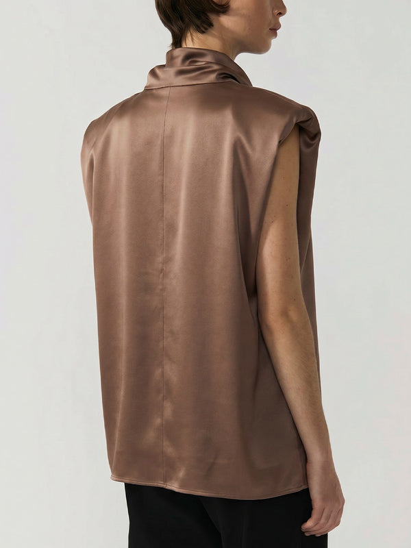 #khaki Brown satin sleeveless top worn by a model on a plain background