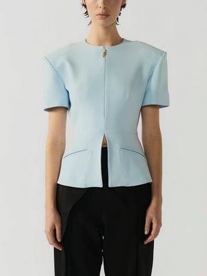 #sky-blue Light blue top with a cut-out design on a plain background