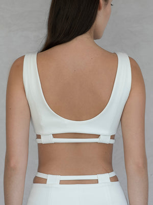 #off-white White sports bra with cut-out design on a plain background