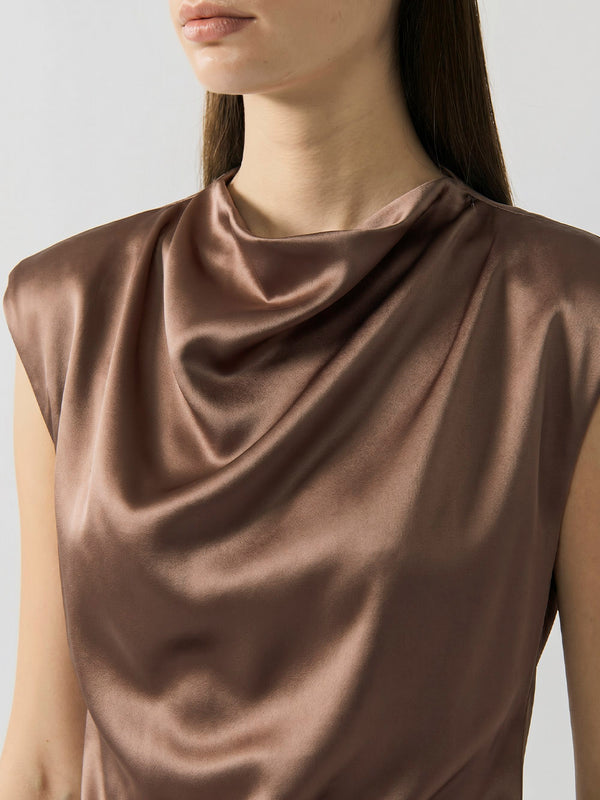 #khaki khaki top worn by a model on a plain background