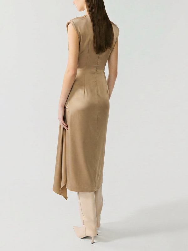 #sand Woman wearing a beige sleeveless dress on a white background