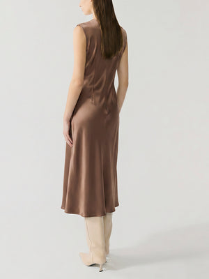 #khaki Woman wearing a khaki sleeveless dress on a white background