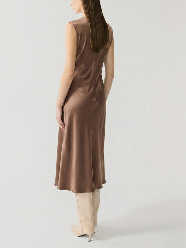 #khaki Woman wearing a khaki sleeveless dress on a white background