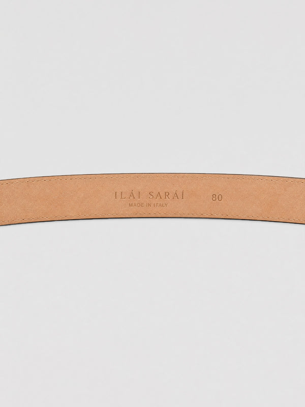 #taupe A close-up of a light tan leather belt strap with debossed branding reading 'ILAI SARAI' and size '80' on a light gray background.