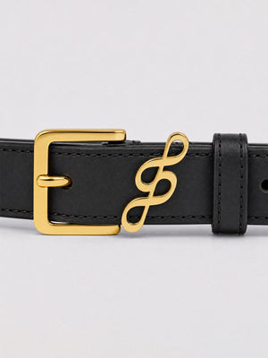 #black A close-up of a black leather belt featuring a polished gold-tone metal buckle and a matching gold infinity symbol charm on the strap, set against a light gray background.